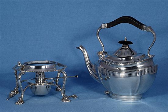 A silver kettle on stand, Height 11 ½”/290mm Width: 9”/230mm Weight 42.8oz/1213g.